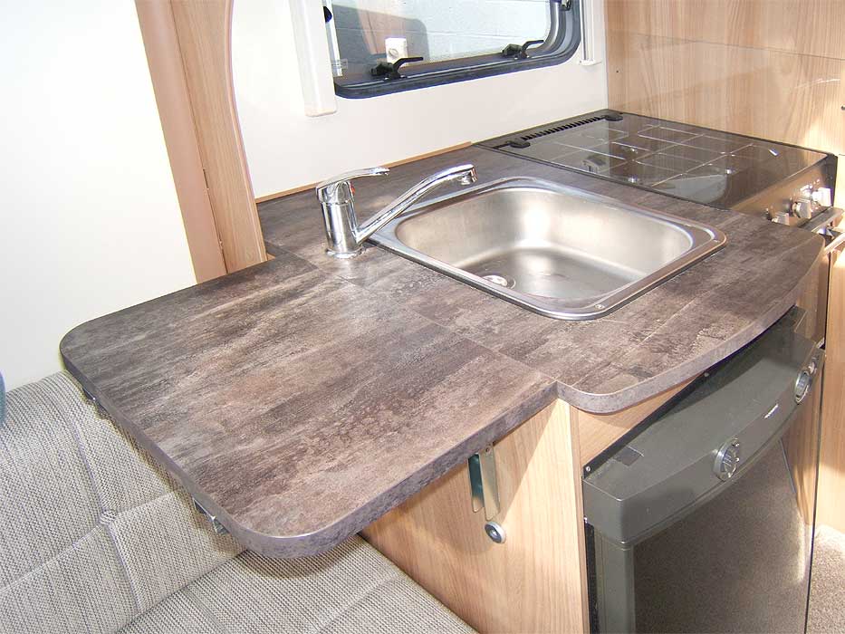 The kitchen has a worktop extension flap shown here in the up postion. It can be folded away when not needed.